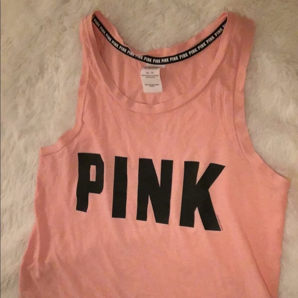 A peach/orange tank top from pink